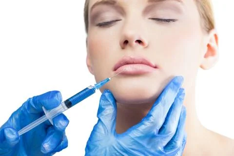 Relaxed pretty model having botox injection on the lips Stock Photos