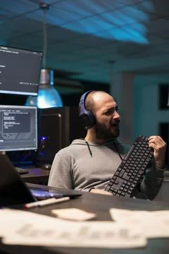 Relaxed Programmer Taking Creative Break at Night Stock-Fotos
