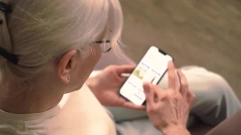 Relaxed smartphone usage in a cozy setting Stock Footage 302745237