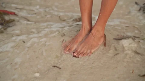 Relaxed stroll along sandy coast. Footsteps taken on peaceful beach at sunset Stock Footage 341668681