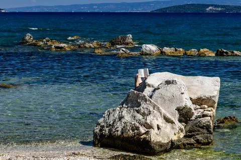 Relaxed Tourist Reading a Book While Sunbathing by the Adriatic Sea in Croati Stock Photos