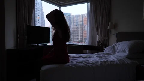 Relaxed woman fall on bed Stock Footage 99806605