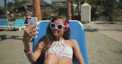 Relaxed woman using mobile phone Stock Footage 93772656