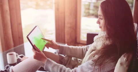 Relaxed Woman Using Tablet with Green Screen at Cozy Home. SLOW MOTION 4K, DCi. 库存影片 68821187