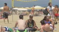 Relaxing and playing volleyball on the beach in Barcelona 4k or 4k+ Resolution