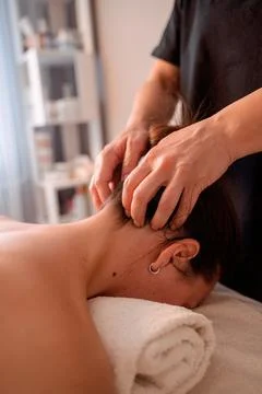 A relaxing back and neck massage in a salon setting Stock Photos
