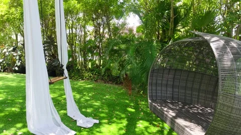 Relaxing Backyard with Hammock Swing Lounge Pod Overlooking Lake in Miramar, FL Stock Footage 311340184