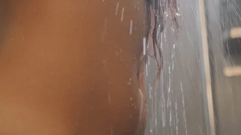 Relaxing bath in cozy hotel. Intimate shower scene with warm water flow. Guest Stock Footage 331749417