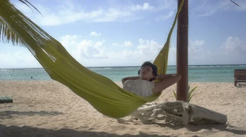 Relaxing beach hammock Stock Footage 36869482