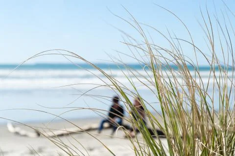 Relaxing at the beach sitting on a Stock Photos