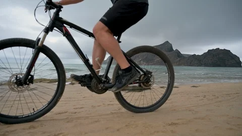 Relaxing bicycle ride on the beach while the waves roll in Stock Footage 114504338