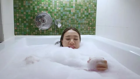 Relaxing Bubble Bath Experience Stock Footage 314637678