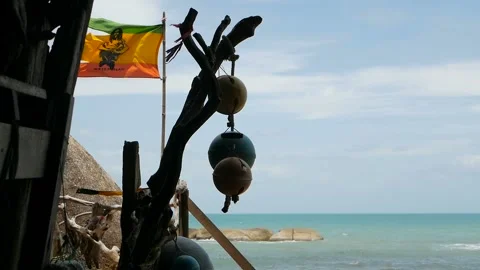 Relaxing cannabis rasta marijuana reggae bar. Rastafarian flag with Bob Marley Stock Footage