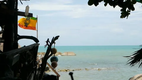 Relaxing cannabis rasta reggae bar on the tropical summer beach from wooden Stock Footage