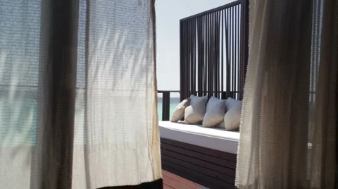 Relaxing couch with flying curtains Stock Footage 1009068