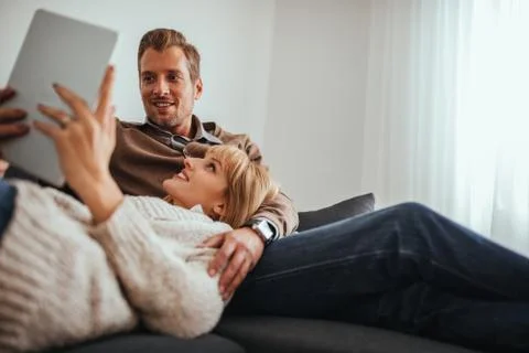 Relaxing couple using technology Stock Photos