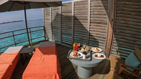 Relaxing dining experience on a water villa in the Maldives Video stock 286104924