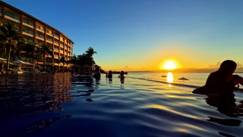 Relaxing evening in Dusit Thani Mactan Cebu luxury infinity pool Stock Footage 334467910
