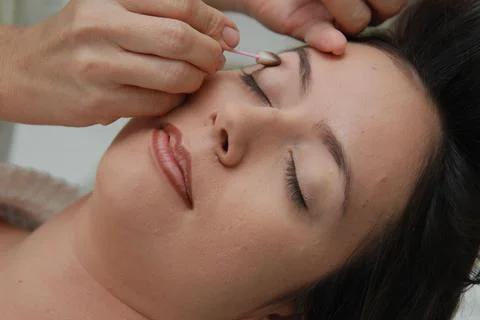 Relaxing eye makeup application Stock Photos