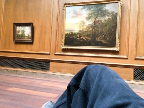Relaxing in front of painting Stock Photos