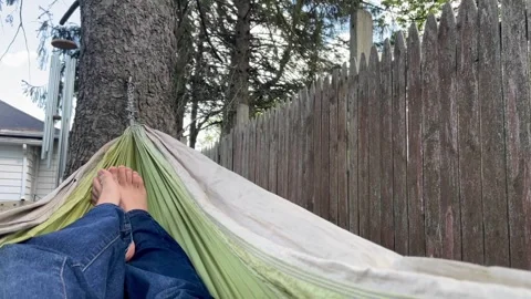 Relaxing in a hammock feet view Stock Footage 277168093