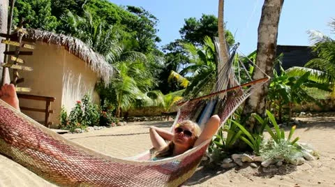 Relaxing in Hammock Stock Footage 12010879