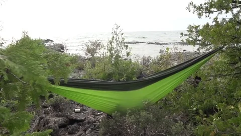 Relaxing in Hammock on Peninsula Stock Footage 80072288