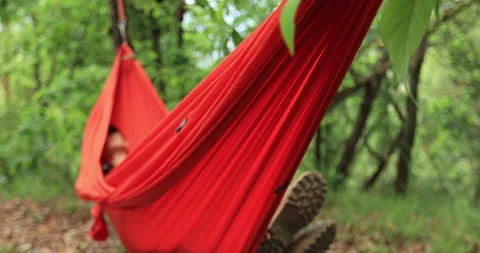 Relaxing in hammock in tropical forest Stock Footage 189800205