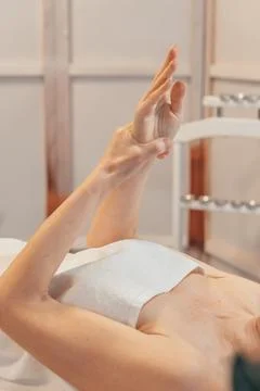 Relaxing Hand Stretch in a Spa Environment Stock Photos