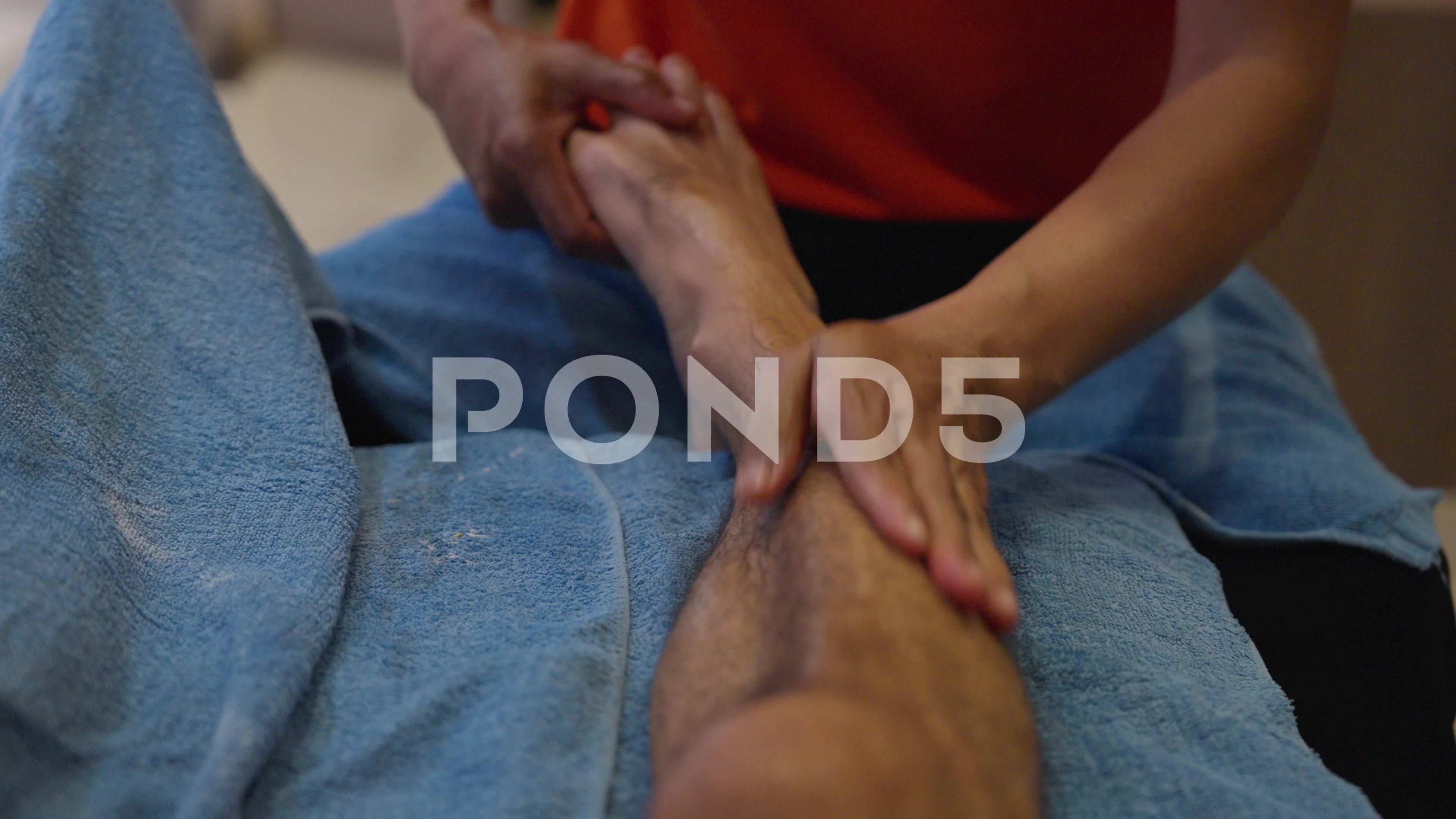 Relaxing healing Thai leg foot oil massage by female spa masseuse therapist