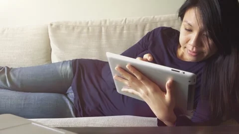Relaxing at Home with a Tablet Stock Footage 318863538