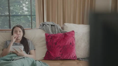 Relaxing at Home with a Tablet Stock Footage 322855235