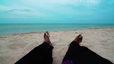 Relaxing human legs on the beach Stock Footage 286763186
