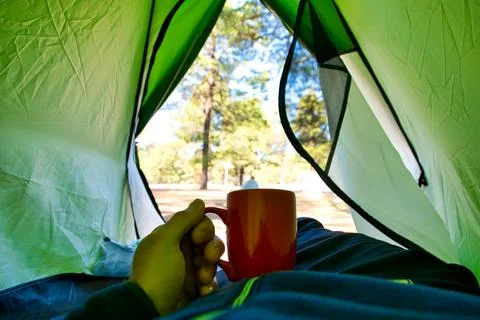 Relaxing inside a tent in the forest Stock Photos