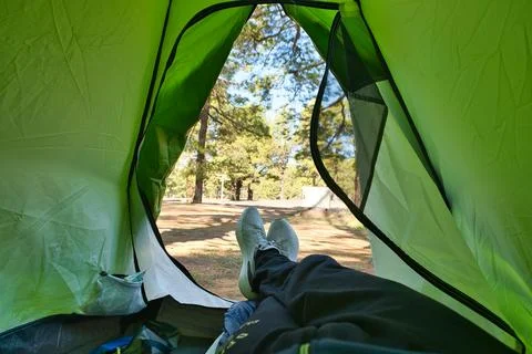 Relaxing inside a tent in the forest Stock Photos