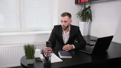 Relaxing Man Staying And Using Mobile Phone For Talking With Colleague. Stock-Footage 130623345