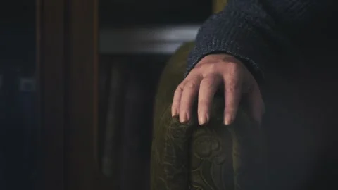 Relaxing Man’s fingers gently tapping on arm of comfy sofa chair Stock Footage 311624112