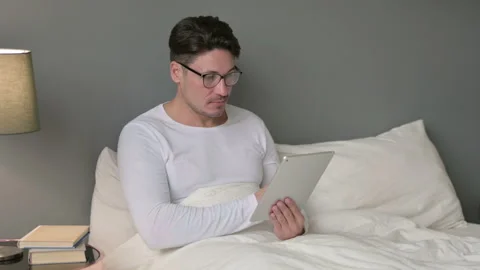 Relaxing Middle Aged Man using Tablet in Bed 스톡 동영상 142365868