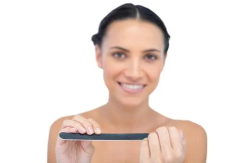Relaxing natural young model using nail file Stock Photos