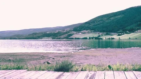 Relaxing nature recreation on an empty beach with ocean and mountain view Stock Footage 107741673