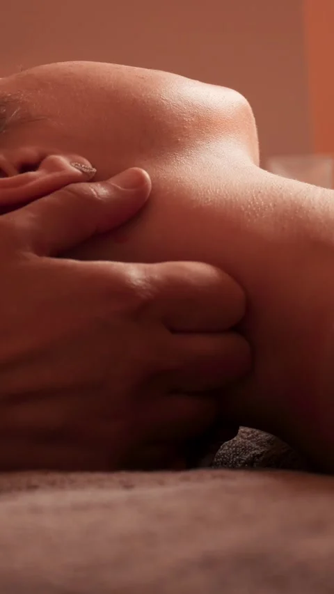 Relaxing neck massage close-up vertical Stockbeeldmateriaal 318101545