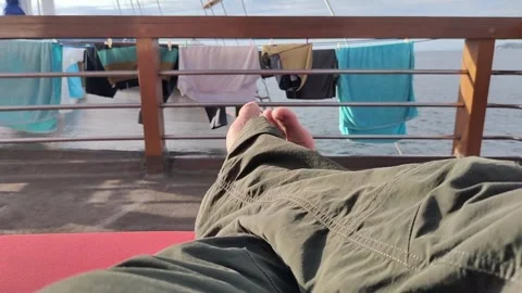 Relaxing by the Ocean with Drying Clothes Stock-Footage 279871338