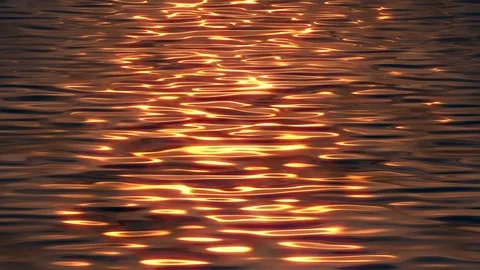 Relaxing ocean sunset waves slowly moving towards camera, repeatable background Stock Footage 125467562
