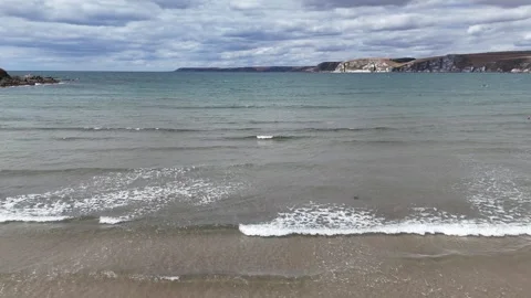 Relaxing Ocean Waves on British Coastal Beach Drone Footage Stock Footage 342293655