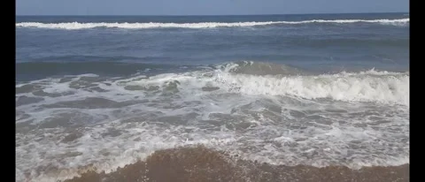 Relaxing Ocean Waves Crashing Gently Along a Serene Beach Shore Stock Footage 284782101