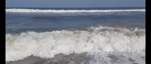 Relaxing Ocean Waves Crashing Gently Along a Serene Beach Shore Stock Footage 284782149