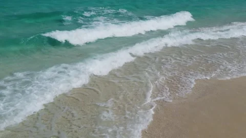 Relaxing ocean waves of the shore of white sand tropical Nakupenda island Stock Footage 251553049