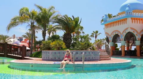Relaxing by the pool Stock Footage 49444952