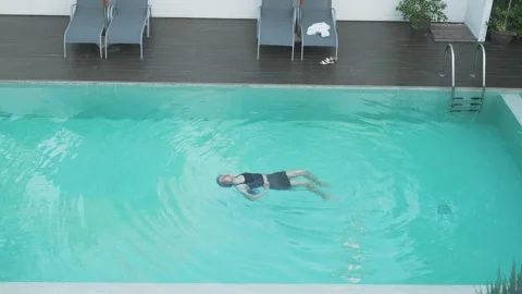 Relaxing in a Pool: The Perfect Summer Escape Stock Footage 314511019
