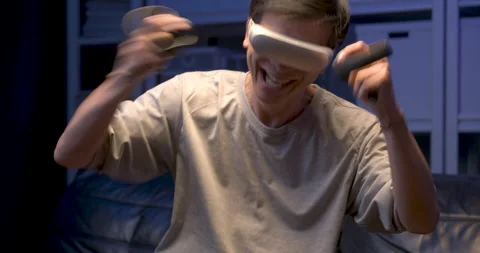 Relaxing senior asian man using VR playing game while working hard at late night Video stock 139822800